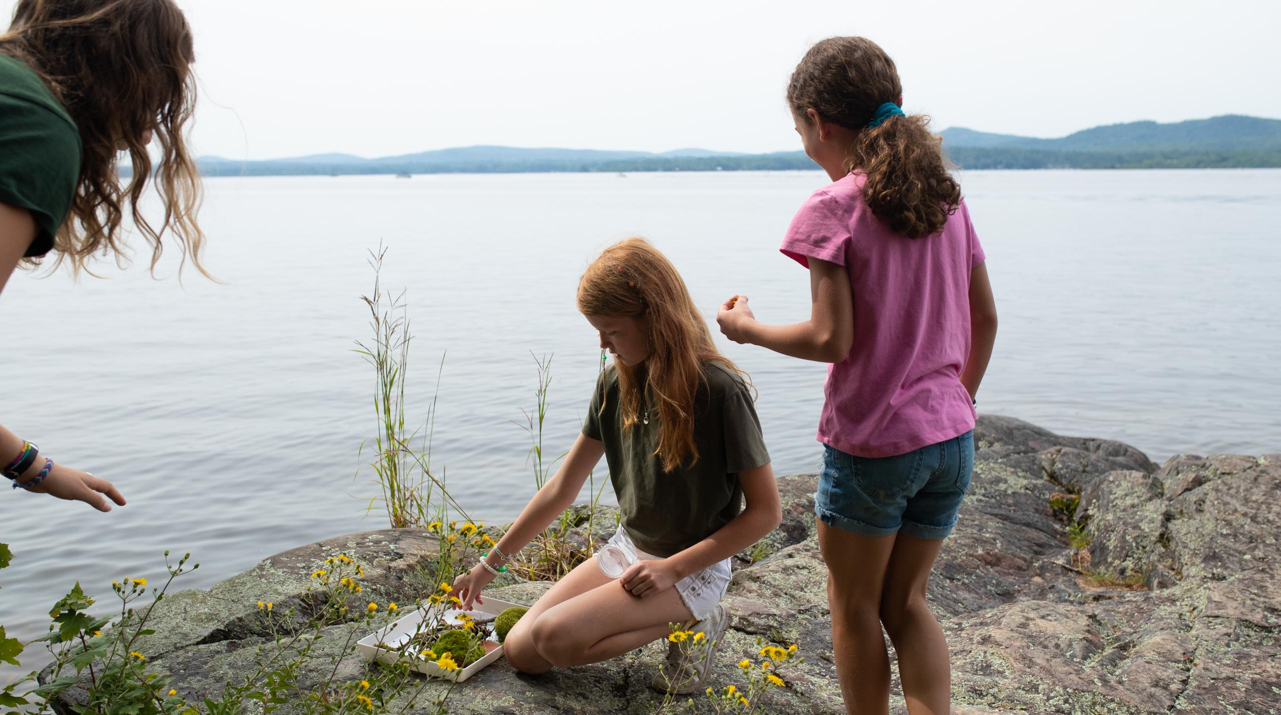 Girls on rock.