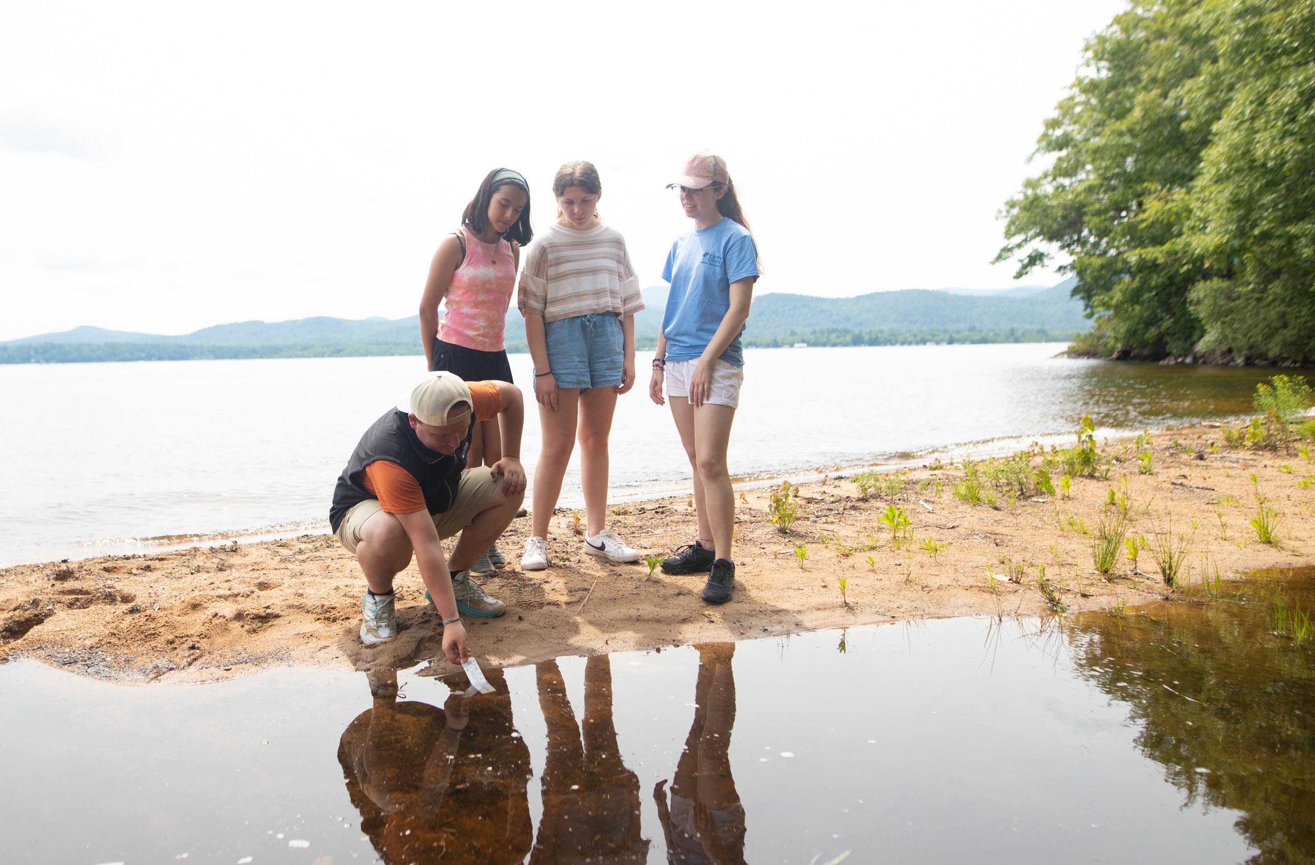 Kids standing by water.